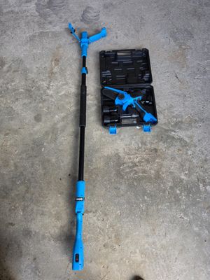 a blue pole and a tool on the floor