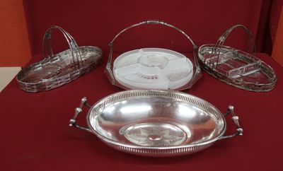 four silver trays on a red table with a red background