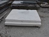 a pile of concrete blocks sitting on the ground