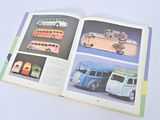 a book with a picture of a bus and a bus on it