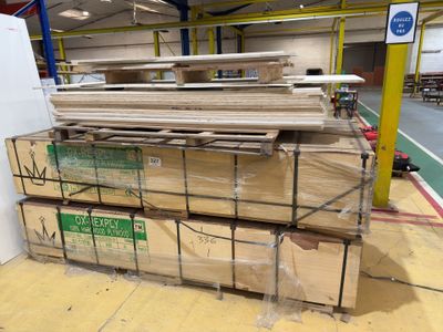 a large stack of boxes sitting on a pallet in a warehouse