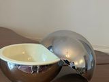 a bowl that is sitting on top of a wooden table
