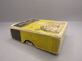 a yellow box with a clock on it sitting on a table