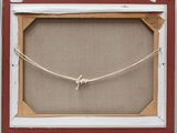 an old picture frame with a rope hanging from it ' s side