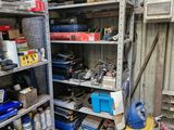 a garage with a lot of tools on the shelves