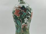 a vase that is sitting on a stand on a white background
