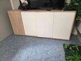 a tv that is sitting on top of a cabinet