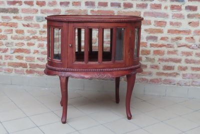 Table basse tambour ovale en bois teinté et sculpté ouvrant …