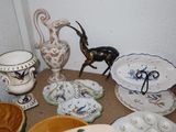many plates and bowls sitting on a table