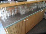 many empty glasses on the counter in the kitchen