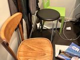 two chairs and a table in the corner of a room