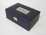 an image of a black box with a silver label on it
