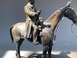 a statue of a man on a horse on display