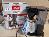 a box with a coffee maker on it and a box with a coffee maker on it