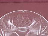 a glass bowl with a design on it on a table