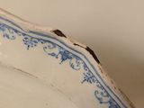 a blue and white plate sitting on a table