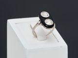 an image of a black and white ring with two diamonds on it