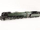 the toy train is green and black on a white background