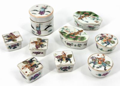 several pieces of porcelain are arranged in a circle on a white surface