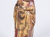 statue of a woman holding a baby in her arms