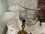 a lot of glass items sitting on the counter