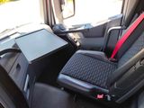 a seat with a tray on it in the back of a car