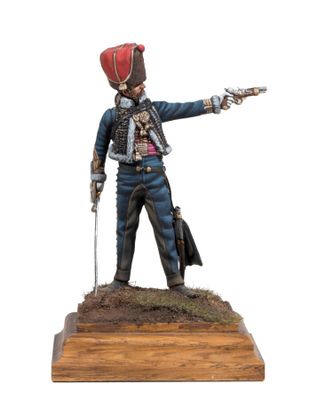 the figurine of a man in uniform is pointing at something