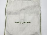 a white bag with the word longchampp on it