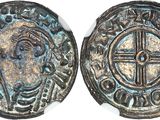 Gros plan sur une pièce de monnaie portant une croix