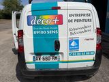 a van that is parked in front of a building