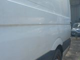 a white van that is parked in a lot