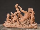 an image of a statue of a group of people sitting on a rock