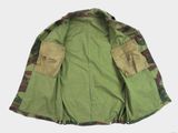 an image of a green jacket with a camouflage pattern on the sleeves