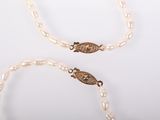 pearl necklace and bracelet set with a gold clasp
