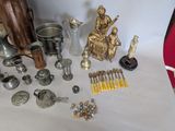 a lot of silver and gold items on the table