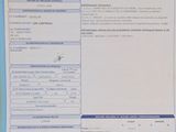 an image of a car registration form on a desk