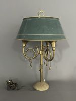 LAMPE BOUILLOTTE en bonze et laiton doré à 3 bras de lumière…