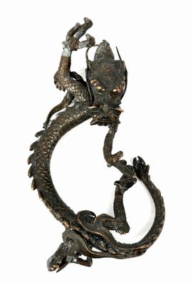 statue of a dragon on a white background with a white background