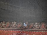 an image of a close up of a shawl with a bird on it
