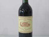 a bottle of wine that is sitting on a table