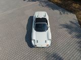 a white car that is parked on the side of the road