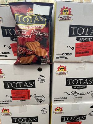 boxes of potato chips stacked on top of each other in a store
