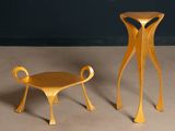 two chairs and a table that are made out of wood