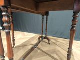 a wooden table with two legs and a wooden table top