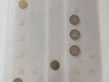 a lot of coins in a plastic bag on a table