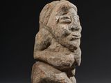 an image of a stone statue of a man with a beard