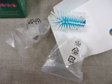 a blue toothbrush sitting on a table next to a package of toothpaste
