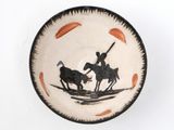 a black and white plate with a picture of a man on a horse and a man on a horse