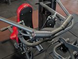 a gym room with a row of machines and other equipment