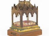 an old wooden and glass display case with a dome on top of it